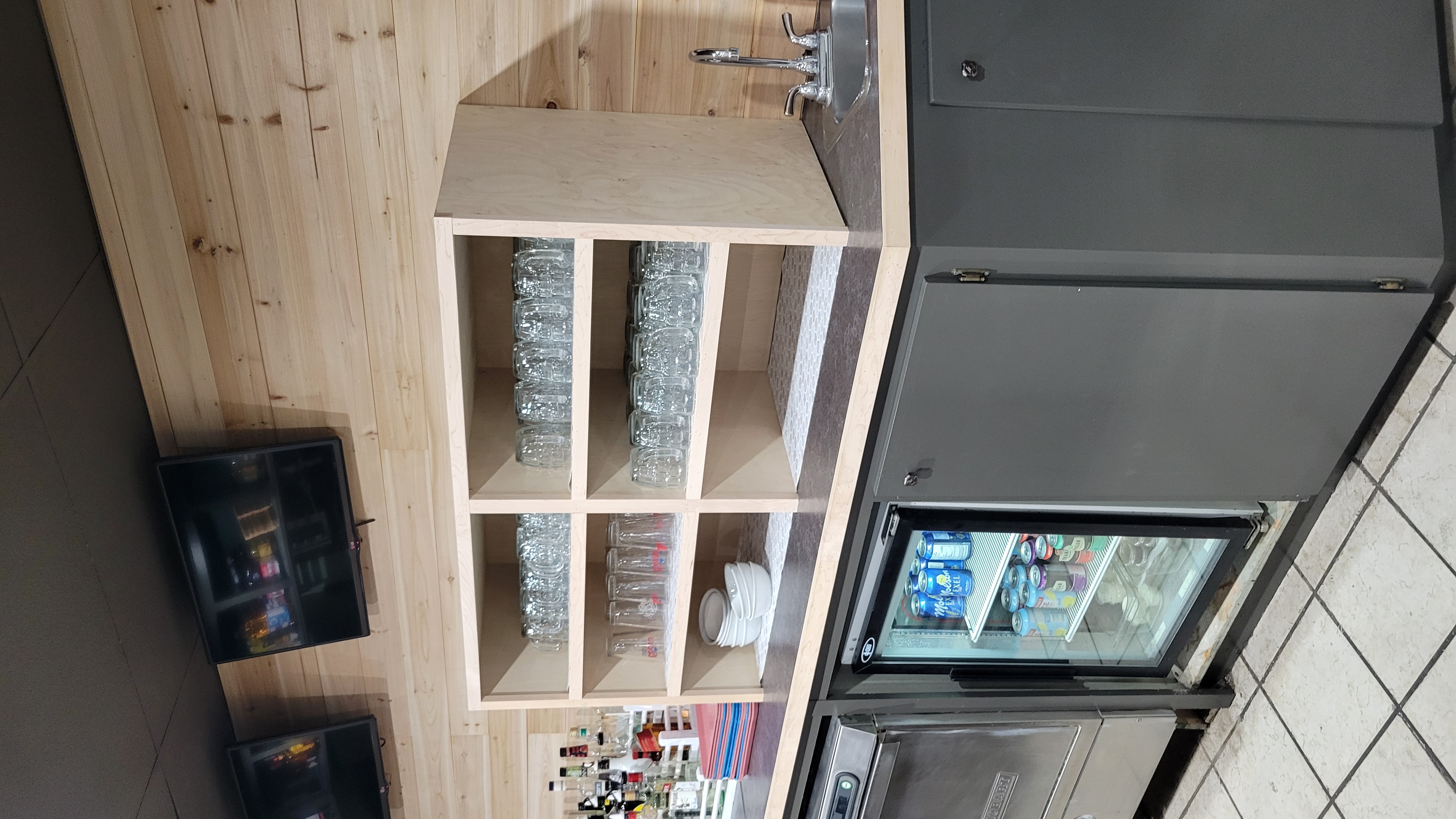 Glassware shelving unit at The Wetmore-Street Bar & Grill